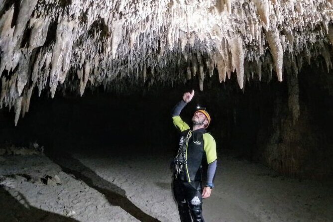 Sea Caving Cova Coloms No Transport - From the first moment, the Sea Caving Cova Coloms tour captures your imagination. For just over five hours, you’ll explore one of Mallorca’s most unique natural wonders—its underground sea caves—without the distraction of artificial lights or staged shows. With a price of around $81, you gain access to a truly authentic experience, guided by knowledgeable locals who know these caves inside and out. The tour starts at a central point in Mallorca and involves a mix of walking, swimming, and climbing, making it a perfect adventure for those comfortable with moderate physical activity.