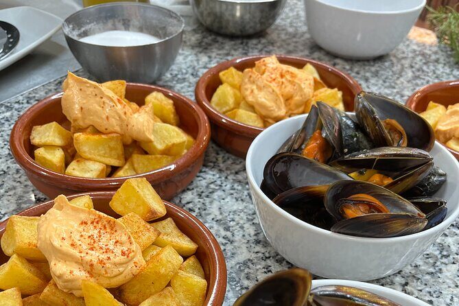 Seafood paella cooking class, tapas and visit to Ruzafa market. - A Deep Dive into the Valencia Paella Class Experience