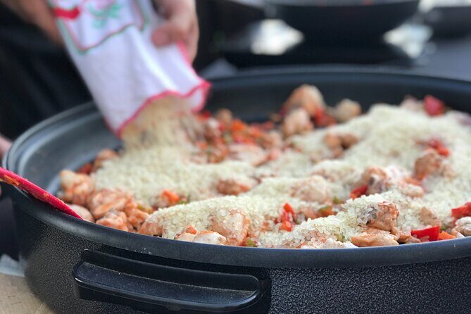 Sevilla: Panoramic Highlights Rooftop Tour & Paella Cooking Class - Key Points