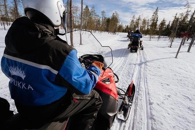 Snowmobiling and ice fishing in Apukka Resort, Rovaniemi - Exploring the Arctic Wilderness in Rovaniemi
