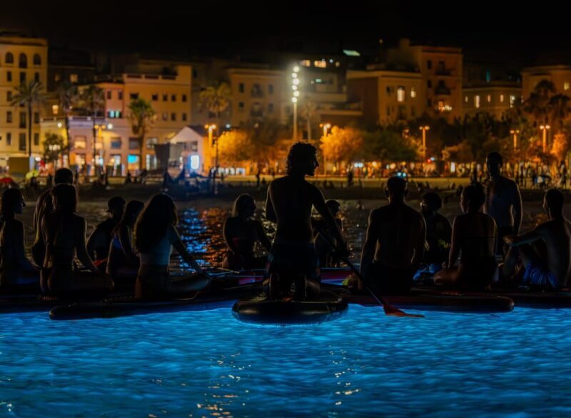 Starlight Paddlesurf during the night in Barcelona - Discover Barcelona’s Night Paddlesurfing Adventure