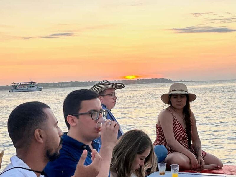 Sunset boat tour open bar and free club entrance Cartagena - Key Points
