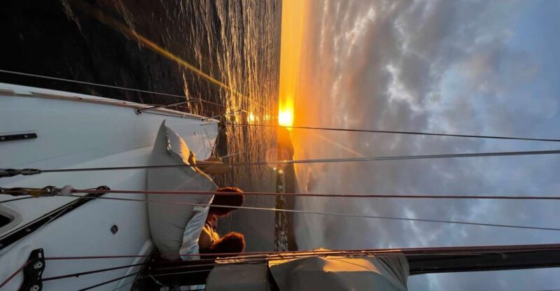 Sunset on a sailing boat - The Swim Below Cabo Girão