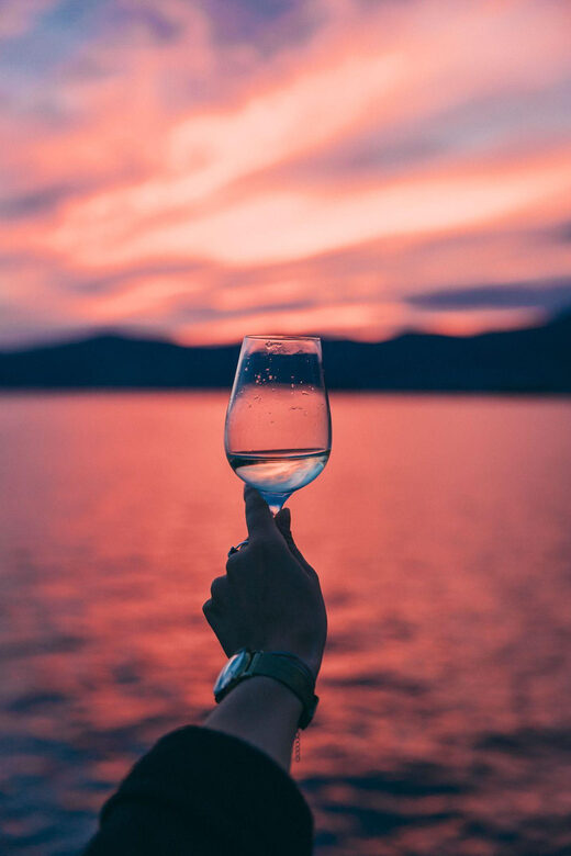 Sunset panoramic cruise with drinks and nighttime dip - Drinks and Comfort: What’s Included
