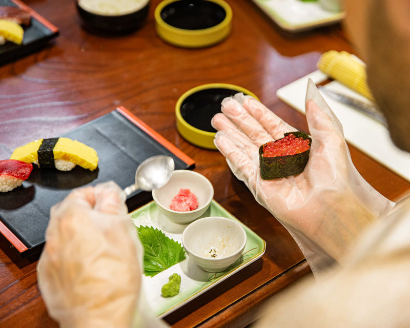 Sushi making class at a century-old sushi restaurant in Tokyo - The instructor and the language choice