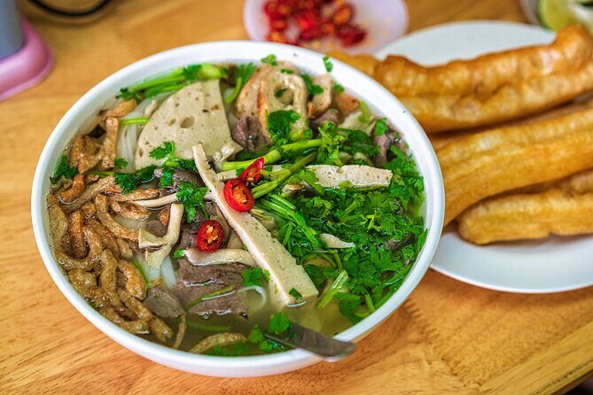 The Coolest Vegan Food Tour in Ho Chi Minh City - Exploring Ho Chi Minh City by Scooter